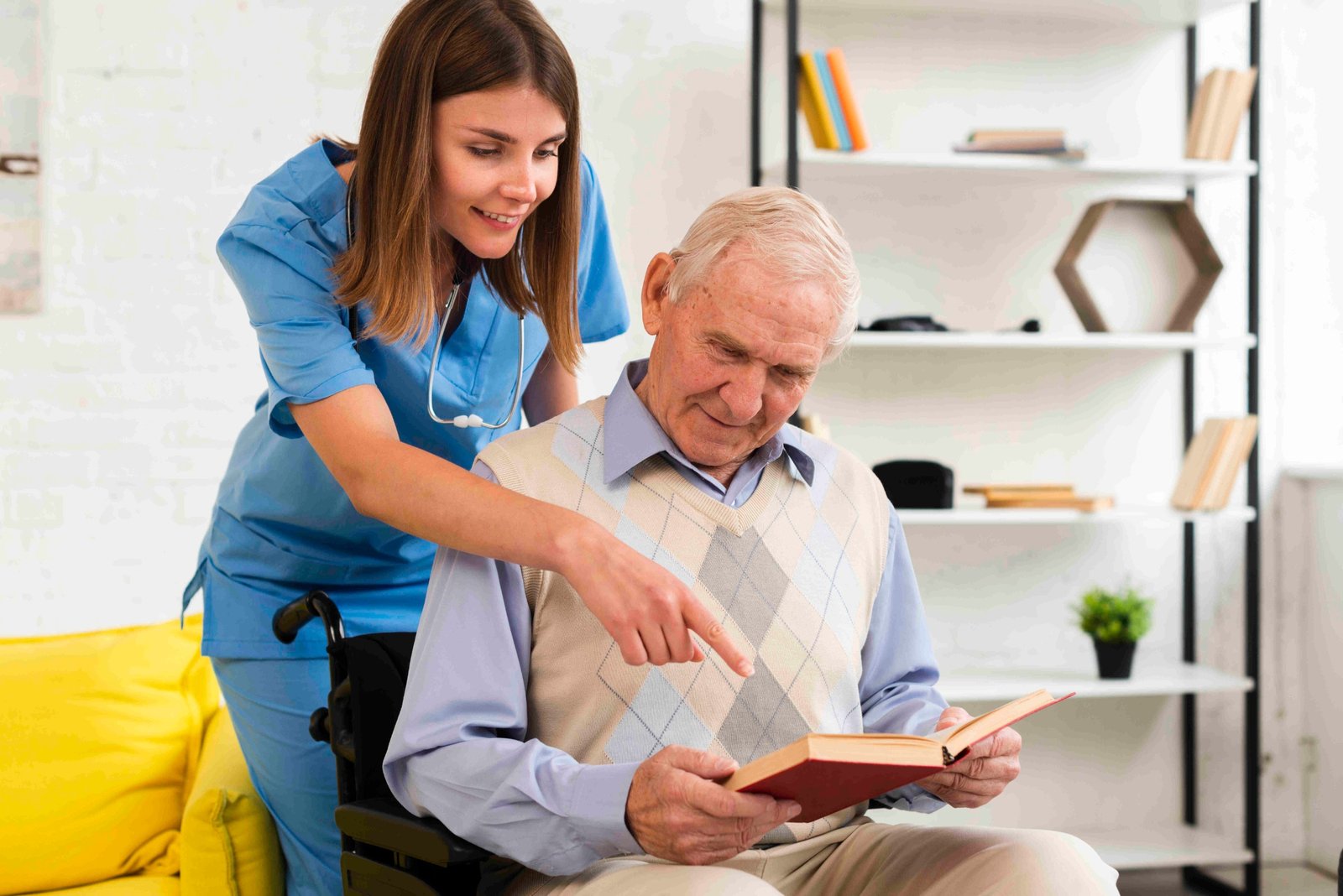 A carer supporting a dementia-friendly reading activity