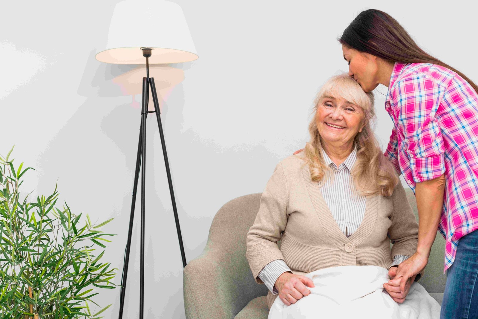 A home carer offering warm, dignified support to an older client
